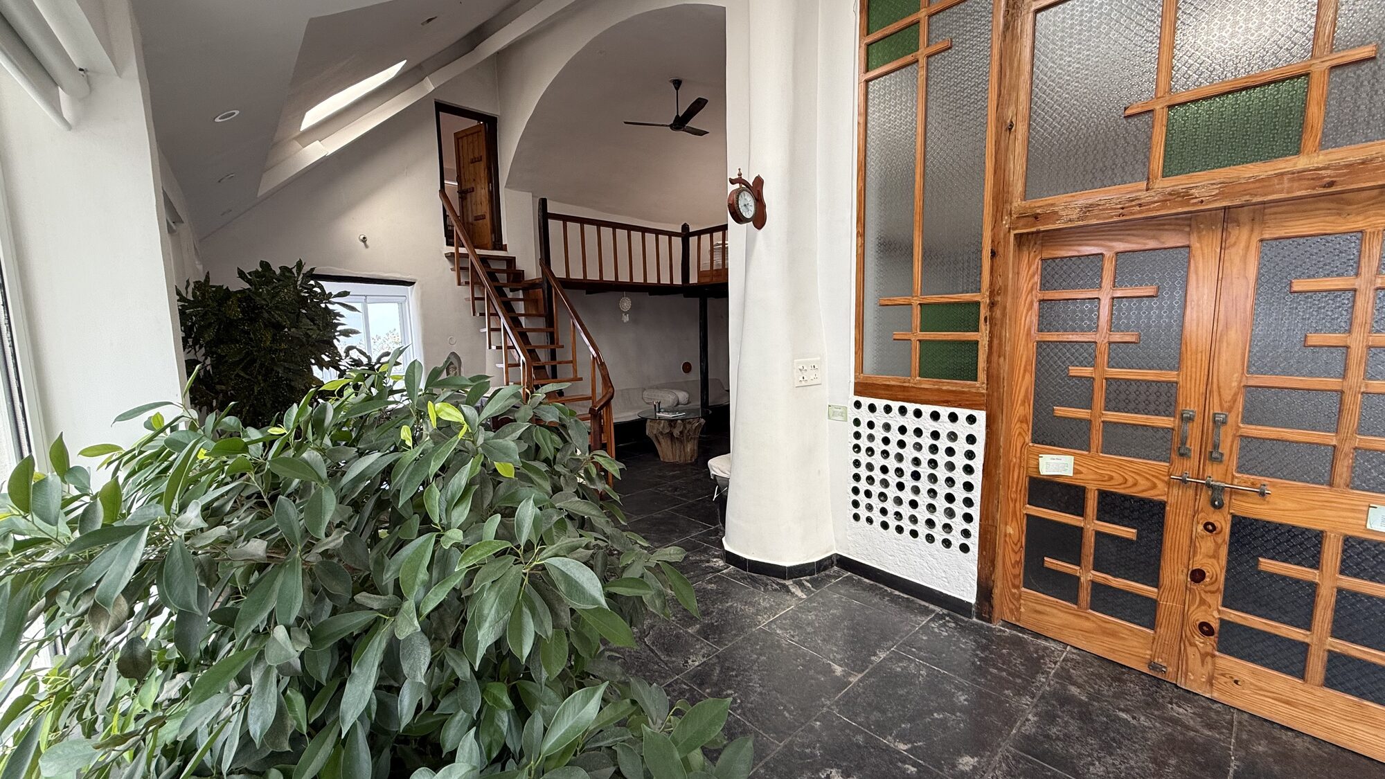 Earthship Homestay entrance nestled in the Himalayan mountains