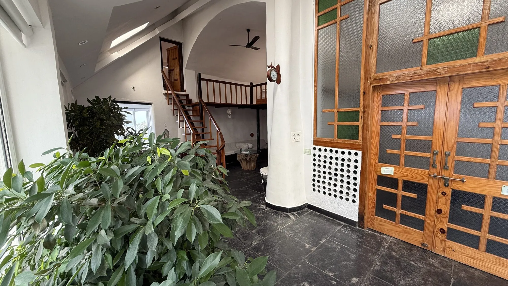 Earthship Homestay entrance nestled in the Himalayan mountains