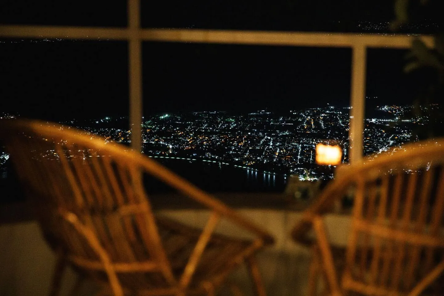Night view of Rishikesh city lights from Earthship Homestay balcony